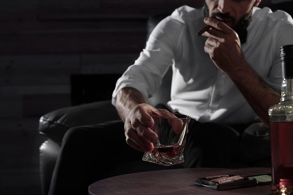 A connoisseur enjoying the cigar lounge at Chairman's Club West Bloomfield, MI.